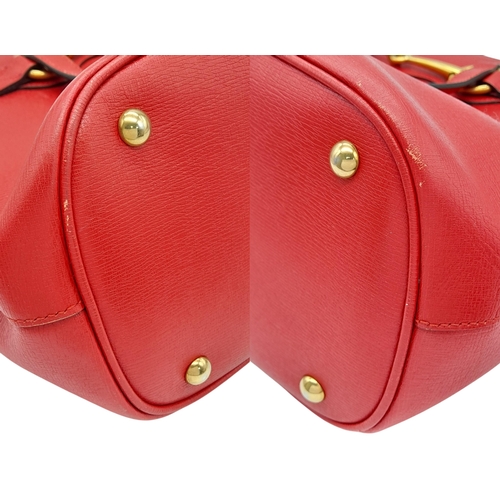 545 - A Gucci Red Leather Horsebit Top Handle Bag. Red leather exterior with gold-toned hardware and dual ... 