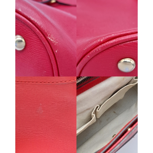 545 - A Gucci Red Leather Horsebit Top Handle Bag. Red leather exterior with gold-toned hardware and dual ... 