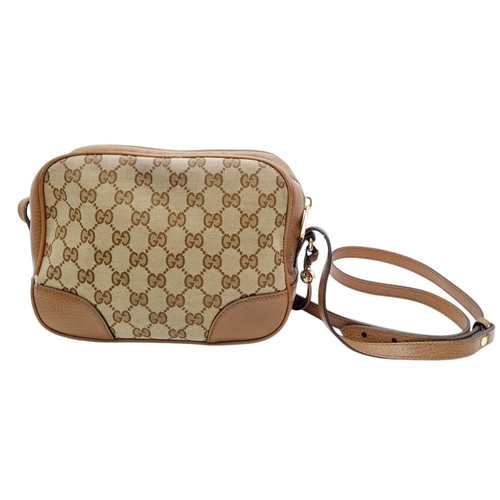 629 - A Gucci Monogram Bree Messenger Bag. Brown and beige monogram canvas exterior with brown leather tri... 