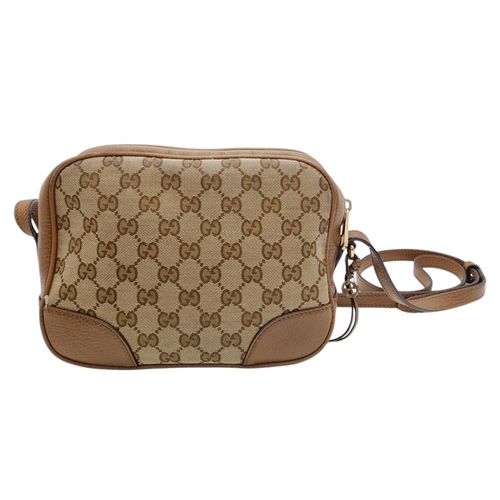 629 - A Gucci Monogram Bree Messenger Bag. Brown and beige monogram canvas exterior with brown leather tri... 