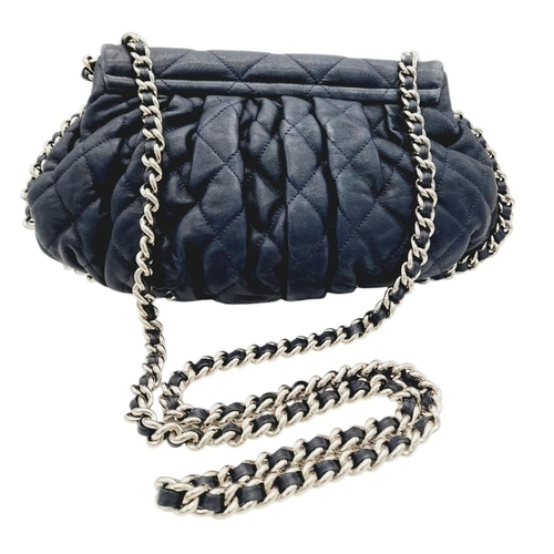 83 - A Chanel Washed Lambskin Quilted Messenger Bag. Blue leather exterior with silver-toned hardware, fe... 