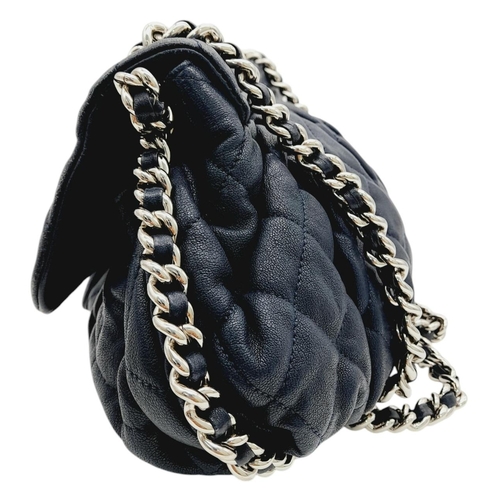 83 - A Chanel Washed Lambskin Quilted Messenger Bag. Blue leather exterior with silver-toned hardware, fe... 