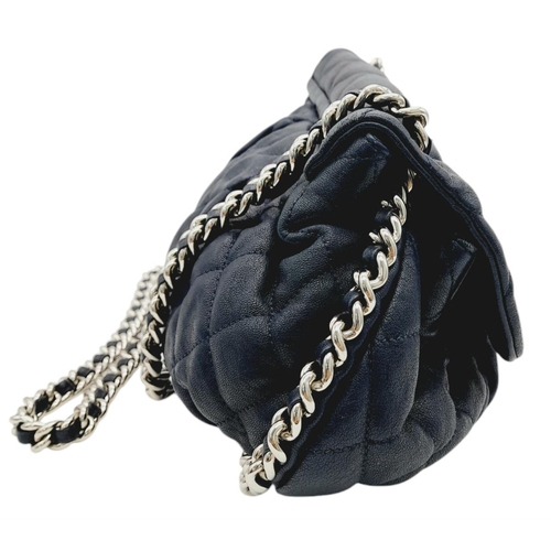 83 - A Chanel Washed Lambskin Quilted Messenger Bag. Blue leather exterior with silver-toned hardware, fe... 