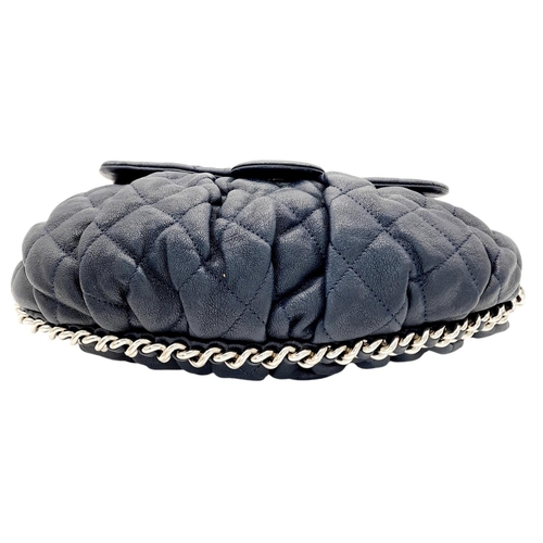 83 - A Chanel Washed Lambskin Quilted Messenger Bag. Blue leather exterior with silver-toned hardware, fe... 