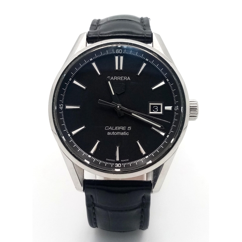 90 - A Tag Heuer Carrera Automatic Gents Watch. Model - WAR211A-1. Black leather strap. Stainless steel c... 