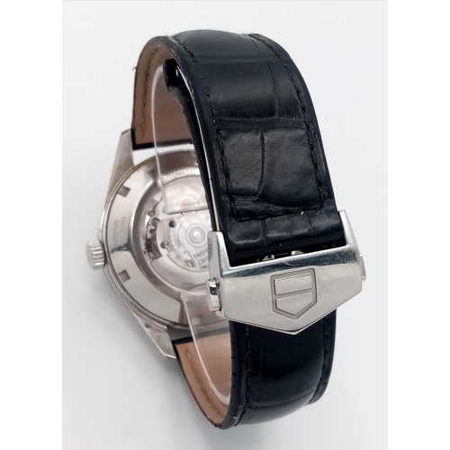 90 - A Tag Heuer Carrera Automatic Gents Watch. Model - WAR211A-1. Black leather strap. Stainless steel c... 