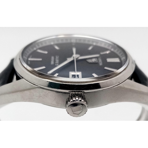 90 - A Tag Heuer Carrera Automatic Gents Watch. Model - WAR211A-1. Black leather strap. Stainless steel c... 