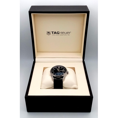 90 - A Tag Heuer Carrera Automatic Gents Watch. Model - WAR211A-1. Black leather strap. Stainless steel c... 