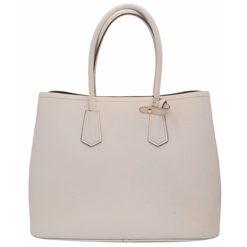 713 - A Prada Saffiano Leather Double Bag. White leather exterior with gold-tone hardware and top handles.... 