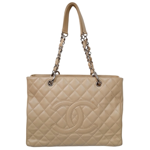 180 - A Chanel Caviar Quilted Tote Bag. Crafted from beige quilted caviar leather, featuring silver-toned ... 