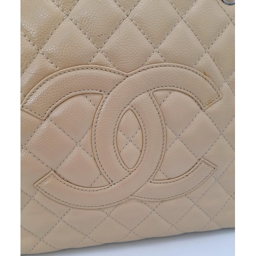 180 - A Chanel Caviar Quilted Tote Bag. Crafted from beige quilted caviar leather, featuring silver-toned ... 