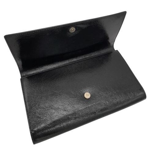 243 - A Saint Laurent Belle De Jour Clutch Bag. Black textured patent leather exterior featuring the class... 