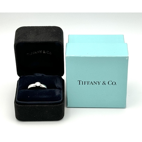 352 - A Tiffany 950 Platinum Diamond Solitaire Ring. 0.25ct. Size I. 
6.1g. Original Tiffany packaging. Re... 