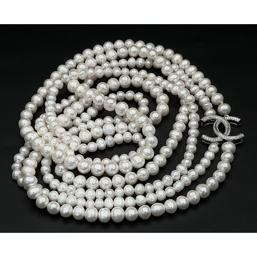 365 - A Cultured Two-Row Pearl Necklace with CC 925 Silver Clasp.
82cm