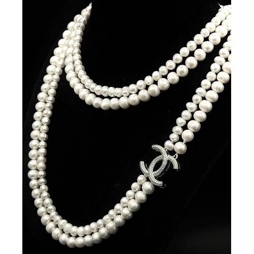 365 - A Cultured Two-Row Pearl Necklace with CC 925 Silver Clasp.
82cm