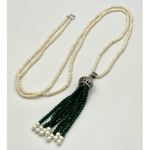 386 - A Cultured Seed Pearl Necklace with Jade Bead Tassel Pendant. Decorative silver attachment. 8cm and ... 