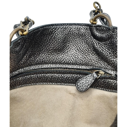 426 - A Bottega Veneta Intrecciato Trimmed Bucket Bag. Metallic leather exterior with signature intrecciat... 