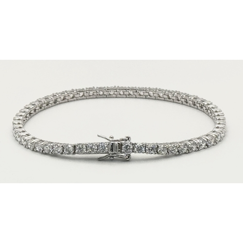 435 - A 925 Silver, White Stone Tennis Bracelet. 18cm.