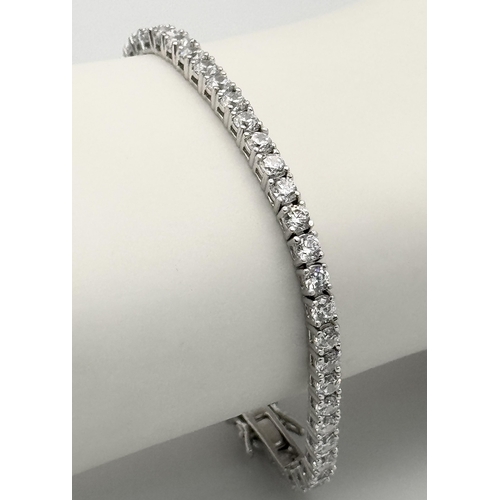 435 - A 925 Silver, White Stone Tennis Bracelet. 18cm.