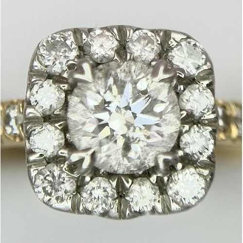 449 - An 18K Yellow Gold, Platinum and 0.5ctw Diamond Ring. Brilliant round cut central diamond with diamo... 