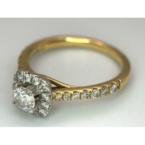 449 - An 18K Yellow Gold, Platinum and 0.5ctw Diamond Ring. Brilliant round cut central diamond with diamo... 