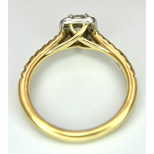 449 - An 18K Yellow Gold, Platinum and 0.5ctw Diamond Ring. Brilliant round cut central diamond with diamo... 