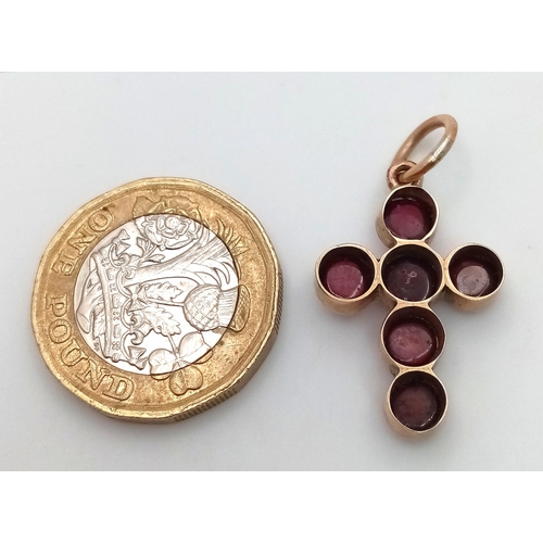 484 - An Antique Garnet and Gold Cross Pendant. 3cm x 2cm. 2.6g