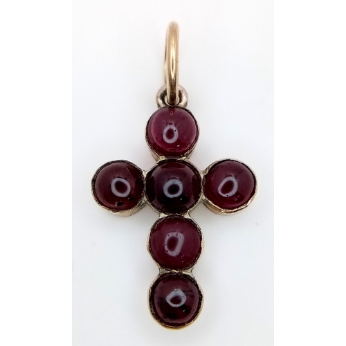 484 - An Antique Garnet and Gold Cross Pendant. 3cm x 2cm. 2.6g