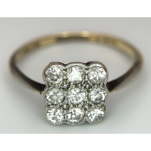 504 - An 18K Yellow Gold, Platinum and Diamond Art Deco Ring. Nine old cut diamonds in a square formation.... 