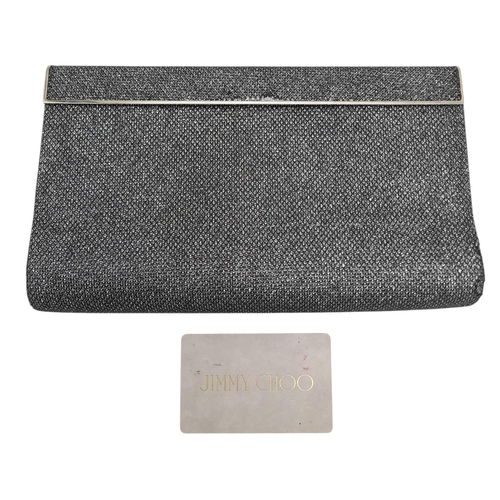 594 - A Jimmy Choo Glitter Clutch Bag. Black glitter exterior with silver-toned hardware, engraved Jimmy C... 