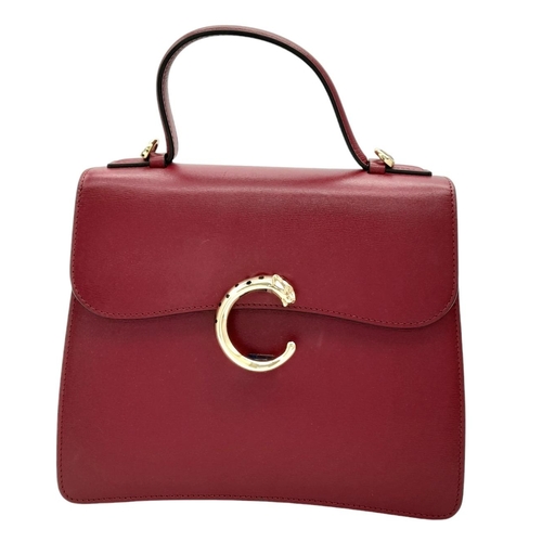 104 - A Panthère de Cartier Handbag. Crafted from poppy red calfskin leather with gold-toned hardware. Fea... 