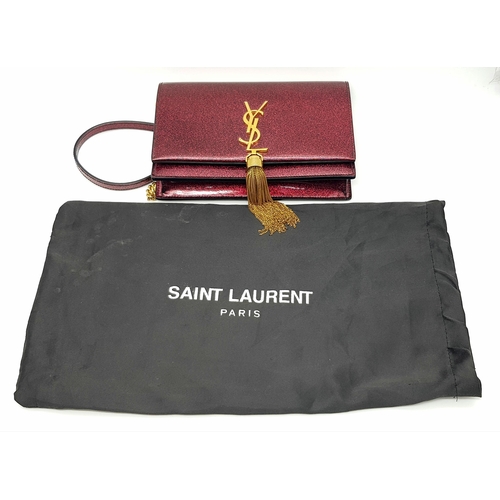 264 - An Yves Saint Laurent Red Glitter Kate Wallet Bag. Patent leather exterior with gold-toned hardware,... 