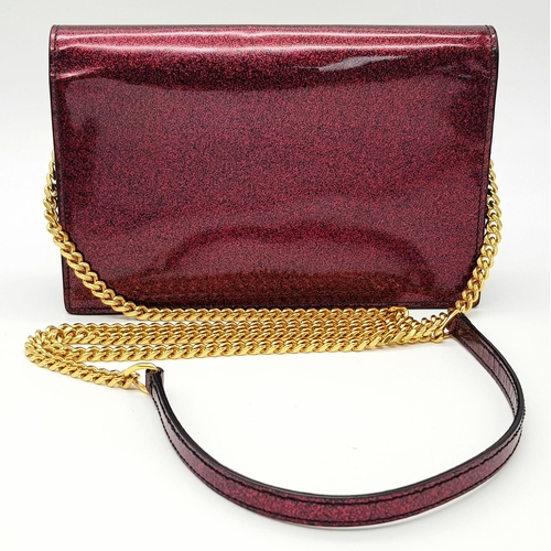 264 - An Yves Saint Laurent Red Glitter Kate Wallet Bag. Patent leather exterior with gold-toned hardware,... 