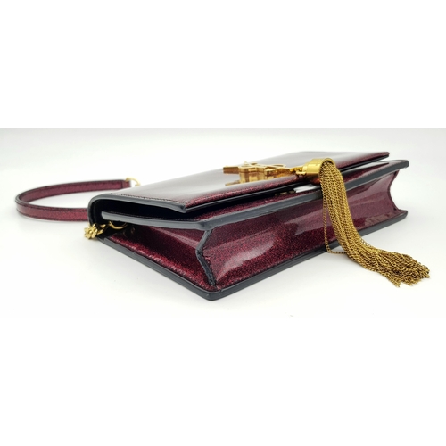 264 - An Yves Saint Laurent Red Glitter Kate Wallet Bag. Patent leather exterior with gold-toned hardware,... 