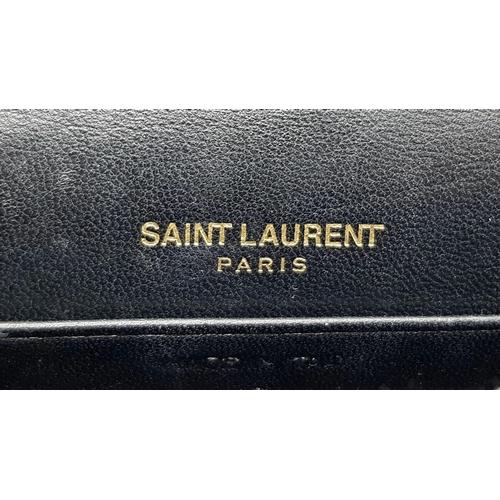 264 - An Yves Saint Laurent Red Glitter Kate Wallet Bag. Patent leather exterior with gold-toned hardware,... 