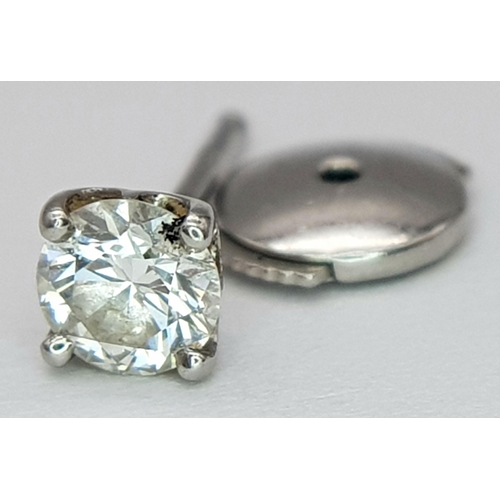 271 - A De Beers Platinum and Diamond Single Stud Earring. 0.20ct. 0.45g. Ref: 20832