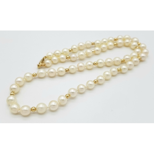 281 - A Cultured Pearl Necklace with 9K Gold Clasp. 44cm