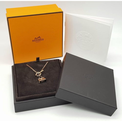 307 - An Hermes Gilded Silver (Kelly) Handbag Pendant on a Gilded Silver Chain. Original Hermes paperwork ... 