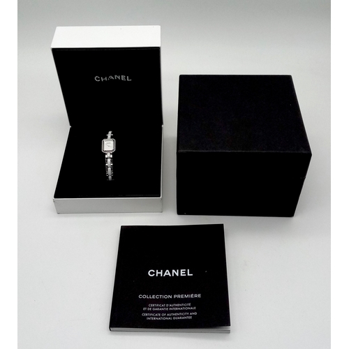 309 - A Chanel Premiere Diamond Quartz Ladies Watch. Stainless steel and white ceramic bracelet. Stainless... 