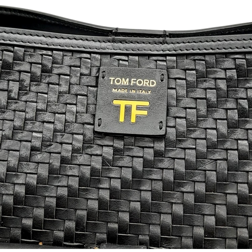 342 - A Tom Ford Black Tote Bag. Woven leather exterior with gold-toned hardware, leather and textile adju... 