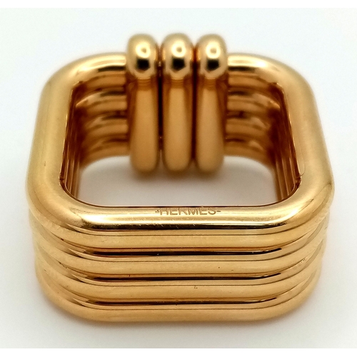 433 - An Hermes Gold Plated Ribbed Scarf Ring. 2.5cm x 2.5cm. Ref: 21013