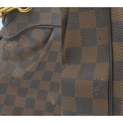 448 - A Louis Vuitton Damier Ebene Trevi GM Bag. Crafted from signature Damier Ebene coated canvas with br... 