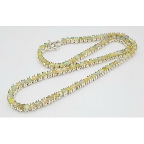 492 - An Opal Tennis Necklace. Set in 925 Silver. 45cm. Cd--1677