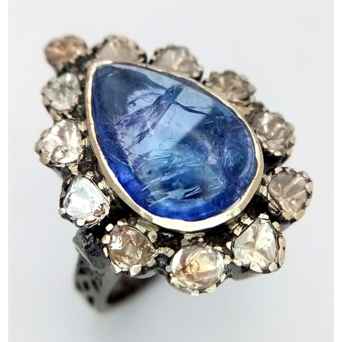 506 - A Pear Shaped 5ct Tanzanite Gemstone Ring with Diamond Accents. Set in 925 Silver. Old cut diamonds ... 