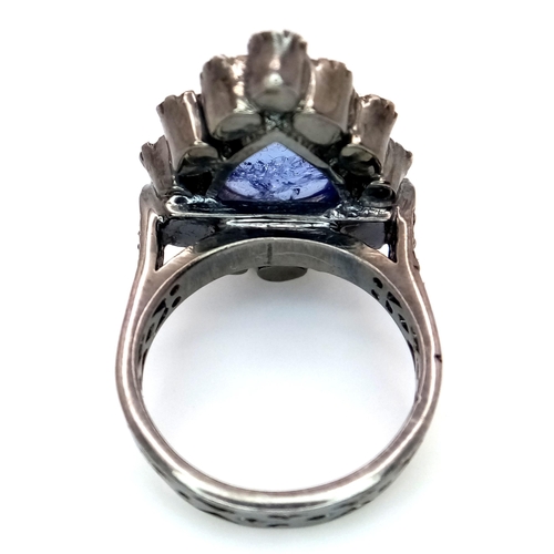 506 - A Pear Shaped 5ct Tanzanite Gemstone Ring with Diamond Accents. Set in 925 Silver. Old cut diamonds ... 