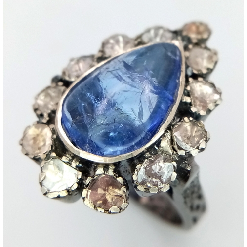 506 - A Pear Shaped 5ct Tanzanite Gemstone Ring with Diamond Accents. Set in 925 Silver. Old cut diamonds ... 