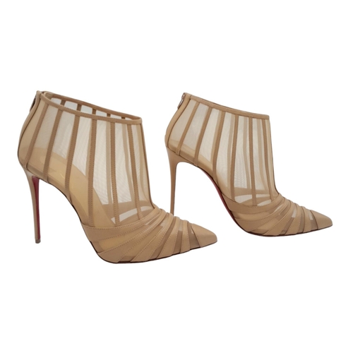 511 - A pair of Christian Louboutin Baleine Heels. Beige mesh with leather stripes, pointed toe, and zip c... 