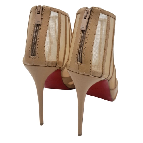 511 - A pair of Christian Louboutin Baleine Heels. Beige mesh with leather stripes, pointed toe, and zip c... 