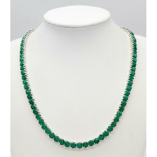 520 - An Emerald Gemstone Tennis Necklace. Set in 925 Silver. 44cm. CD-1669