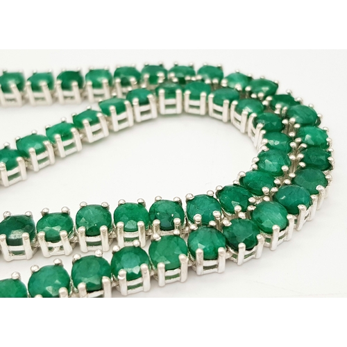 520 - An Emerald Gemstone Tennis Necklace. Set in 925 Silver. 44cm. CD-1669